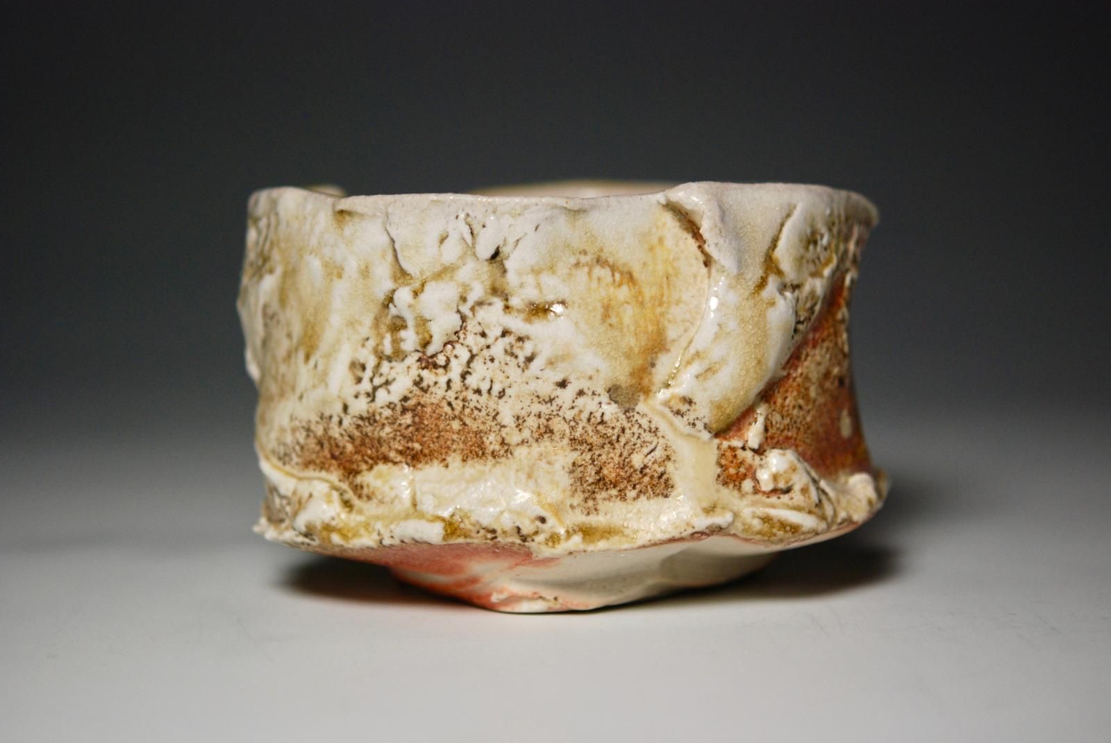 Chizenyu ChawanHand carved and hollowed ( Kurinuki technique ) stoneware. Natural ash glaze and anagama kiln fired for 5 days to cone 12. Honorable mention - Workhouse Clay International 2017, Workhouse Arts Centre, Lorton, VA.  Juror Chris GustinWith wooden box by Lucien Koonce