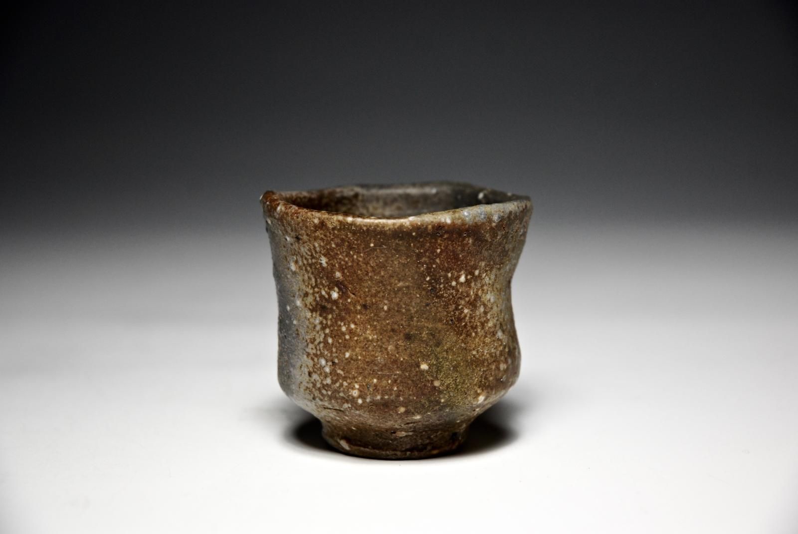 Sake cup, dark grey reduction , stoneware, 7 days Anagama firing by Uwe Löllmann