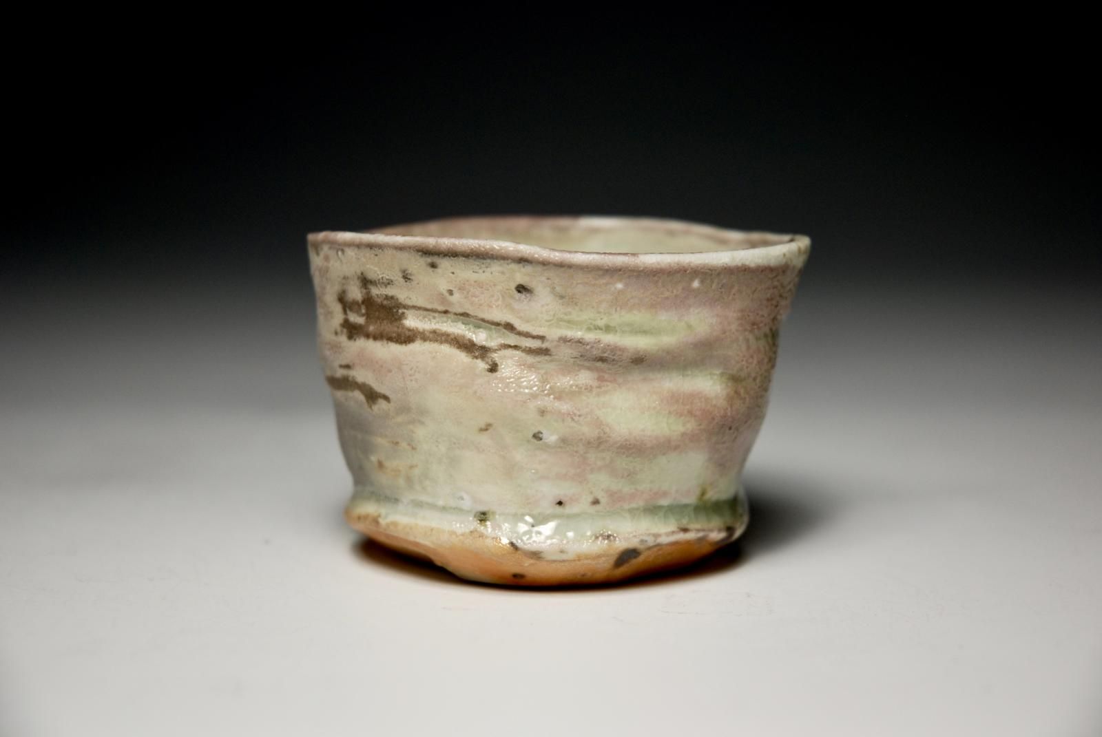 Petit Cup.  Individual Slow Thrown with Hand Trimmed Foot.  Porcelain Body with Locally Sourced Indigenous Rock Grits.  Celadon Glaze. by Sim Taylor
