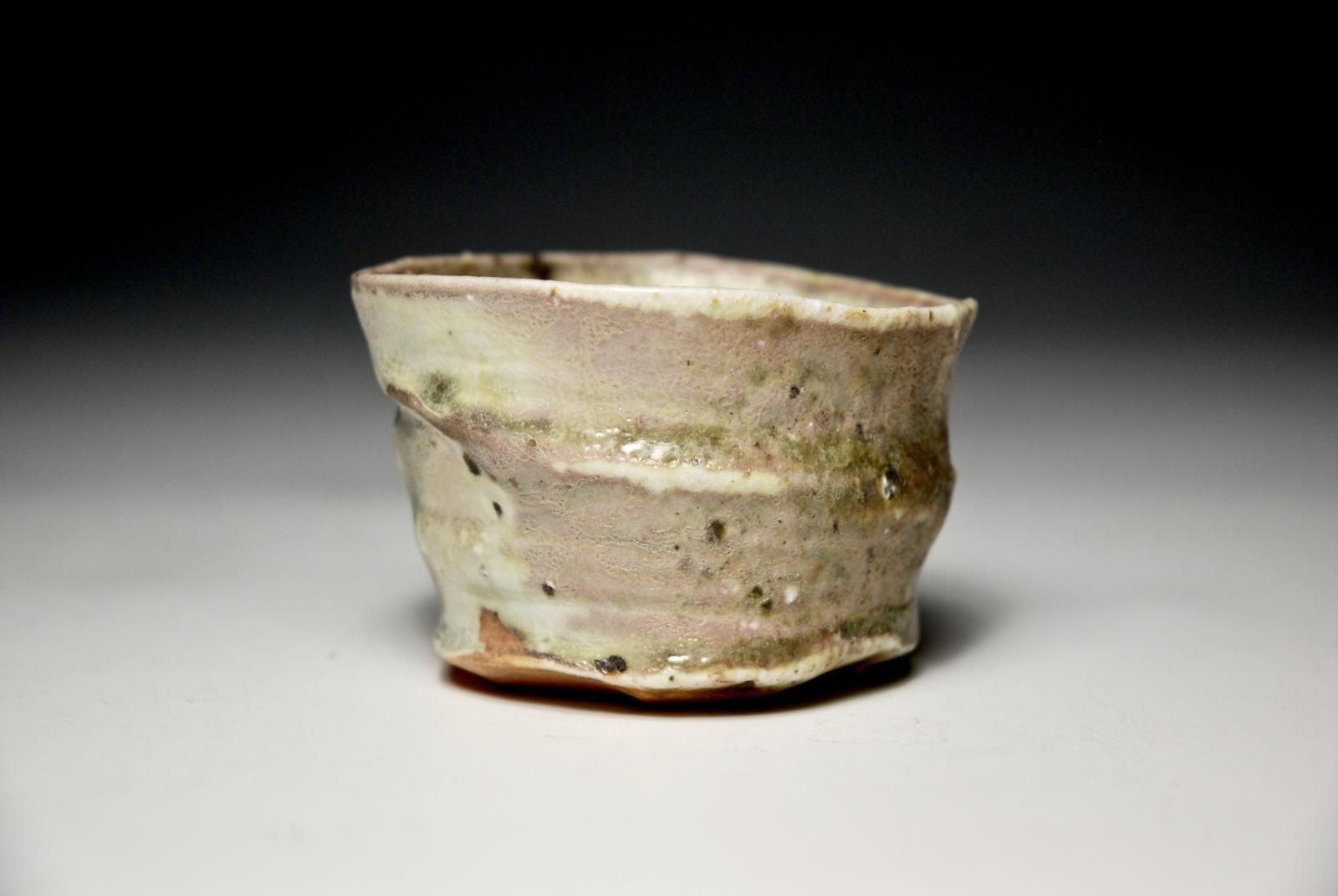 Petit Cup.  Individual Slow Thrown and Hand Trimmed Foot.  Porcelain Body with Local Sourced Indigenous Rock Grits and Celadon Glaze. by Sim Taylor