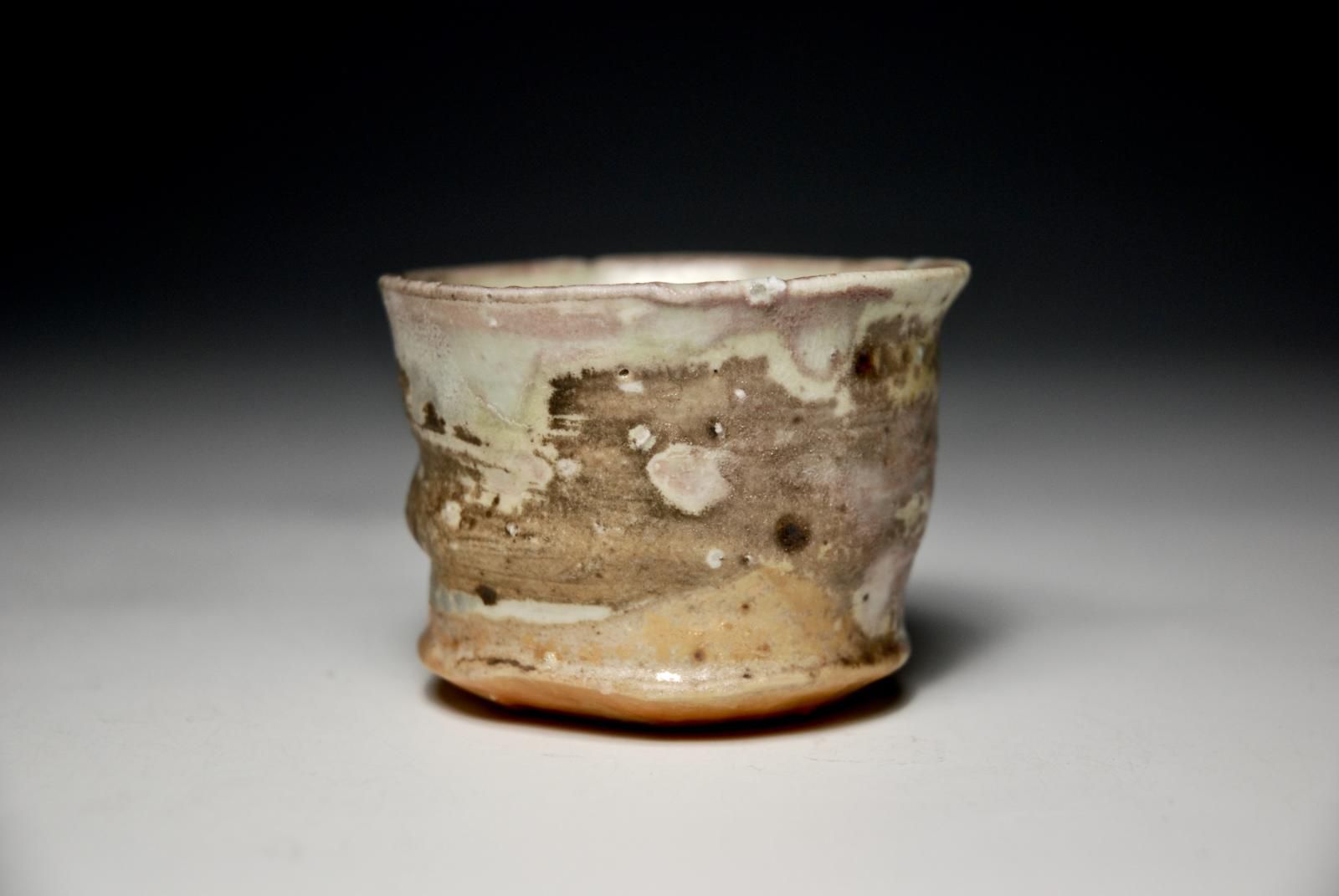 Petit Cup.  Individual Slow Thrown and Hand trimmed foot porcelain body with locally sourced  rock grits and celadon glaze. by Sim Taylor