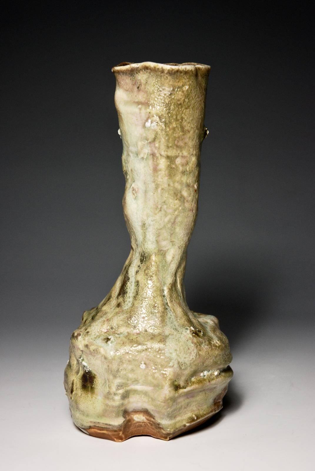 Individual Pourer.  Slow Thrown in two parts, hand assemble and manipulated with a trimmed foot.  Porcelain Body with locally sourced indeignous rock grits.  Celadon Glaze with varying ash Patternation.  Anagama Fired. by Sim Taylor
