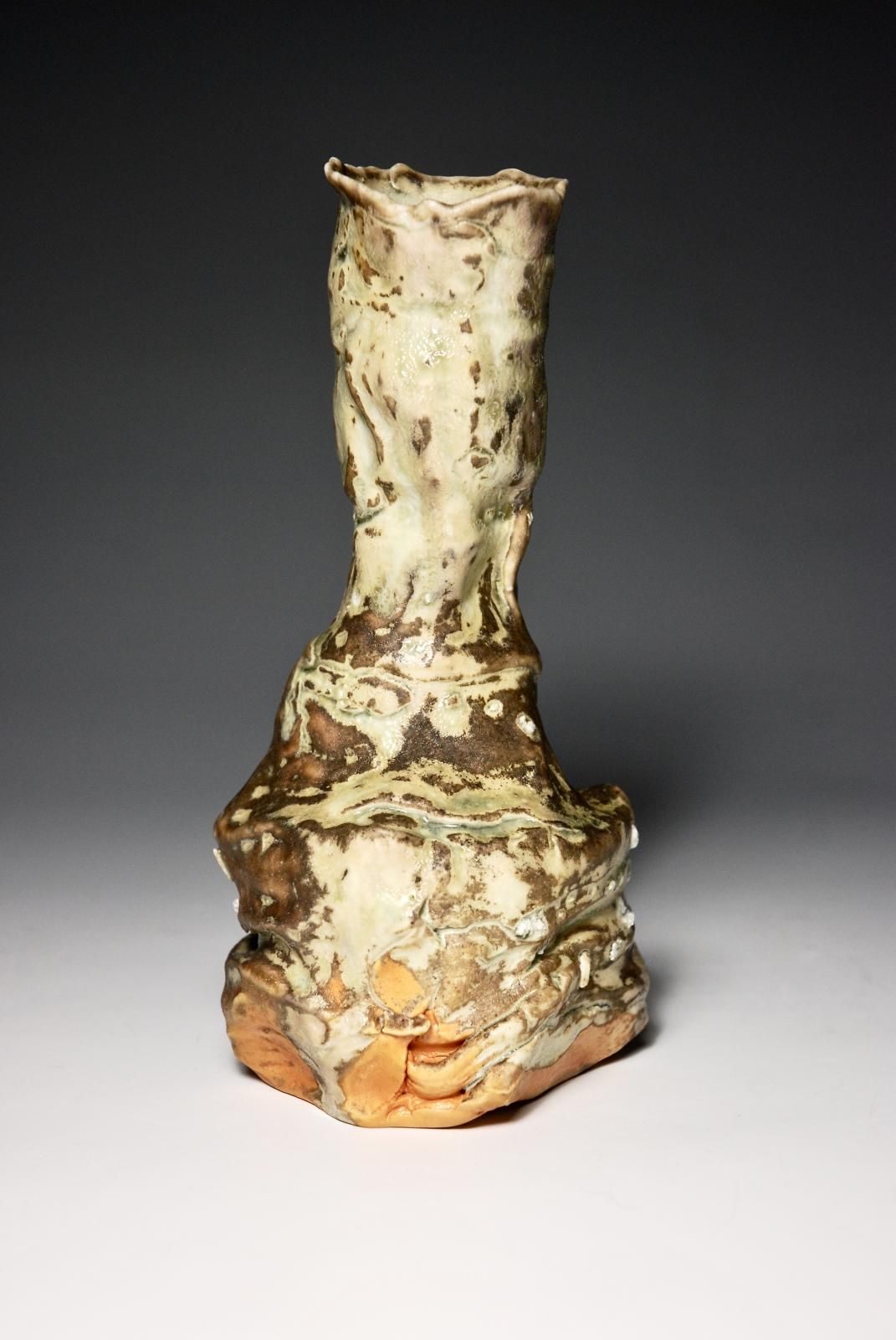 Pourer.  Individual Slow thrown in two parts and hand assembled and manipulated with a trimmed foot.  Porcelain Body with locally sourced indignous rock grits,  Celadon Glaze with varying ash patternation.  Fired  in an Anagama Kiln. by Sim Taylor